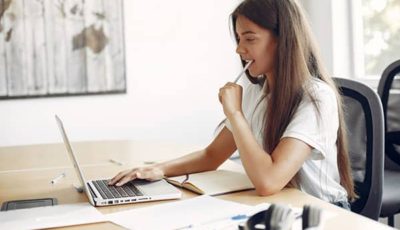 young-student-sitting-table-use-laptop2